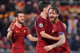 (From left) AS Roma&#039;s Alessandro Florenzi, Kevin Strootman and Daniele de Rossi celebrating their 3-0 win over Barcelona in the Champions League quarter-final, second leg.