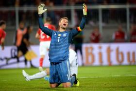 Germany goalkeeper Manuel Neuer reacts after conceding the second goal.