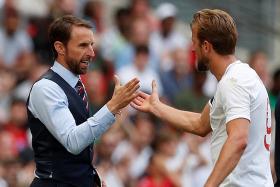 England manager Gareth Southgate shaking hands with Harry Kane after their friendly win over Nigeria.