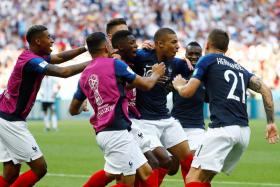 The France team celebrate after Kylian Mbappe scored their fourth goal.