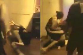 The couple are seen repeatedly hitting the two men in the video. 