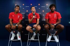 (From left) Pierre-Emerick Aubameyang, Aaron Ramsey and Alex Iwobi speaking at a media event on Friday (July 27).