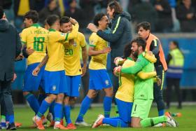 Brazil players celebrate after reaching the Copa America semi-finals.