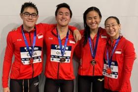 (From left) Darren Chua, Quah Zheng Wen, Quah Ting Wen and Cherlyn Yeoh after their record-breaking swim in the 4x100m freestyle relay.