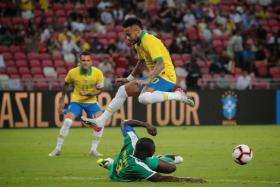 Brazil’s Neymar leaping over the challenge of Senegal’s Kalidou Koulibaly during their 1-1 draw at National Stadium on Thursday.