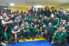 Kedah's players and staff celebrating after booking their place in the Malaysia Cup final.