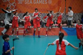 The Singapore women&#039;s floorball team celebrating their victory against Thailand.