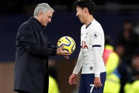 Tottenham Hotspur manager Jose Mourinho celebrating with Son Heung Min after the match. 