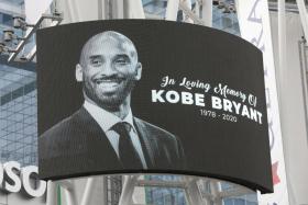 An image of Kobe Bryant is flashed outside Staples Center, shortly after his death.