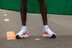 This file photograph taken on October 12, 2019, shows the running shoes of Kenya&#039;s Eliud Kipchoge as he stands after his attempt to break the two-hour barrier for the marathon at The Reichsbrücke in Vienna.
