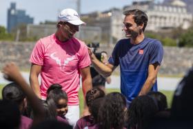 Roger Federer (right) and Rafael Nadal taking part in a Roger Federer Foundation Learning through Play session with South African children ahead of the Match in Africa Cape Town charity event on Friday.