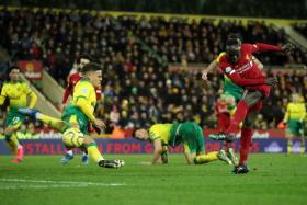 Sadio Mane scoring the only goal of the game against Norwich City, following a flighted pass by Jordan Henderson.