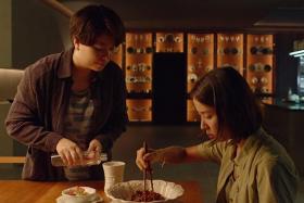 Cho Yeo-jeong (right) and Jang Hye-jin in the ram-don scene in Parasite.