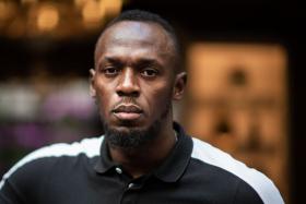 Usain Bolt said he had no symptoms, but urged his friends to take precautions.