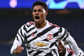 Manchester United forward Marcus Rashford celebrating after bagging the winner in his side&#039;s 2-1 victory away to Paris Saint-Germain in the Champions League.