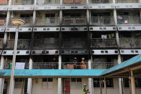 Couple and son jump from second-storey flat to escape fire 