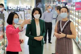 From left: FairPrice Group CEO (Retail Business) Elaine Heng, Minister of State for Social and Family Development and Education Sun Xueling and FairPrice General Manager (Health &amp; Wellness) ST Ang at the Unity Pharmacy store at VivoCity on March 11, 2021. 