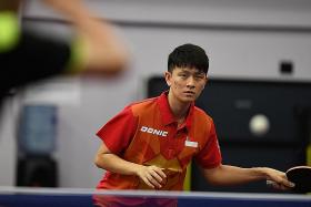 Table tennis bat behind Clarence Chew’s Olympics