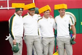 Team Europe&#039;s players (from left) Lee Westwood, Ian Poulter, Rory McIlroy, and Paul Casey wearing cheeseheads on the first hole during practice rounds for the 43rd Ryder Cup golf competition at Whistling Straits. 
