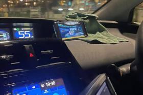A ComfortDelGro taxi driver was seen watching a programme on his mobile phone while driving.