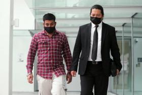 Mr Kirpal Singh leaving the State Courts yesterday with his lawyer, Mr Josephus Tan. 