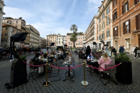 People dining near Piazza di Spagna in Rome on Oct 29, 2021. Some travel companies have seen a few cancellations of European trips.