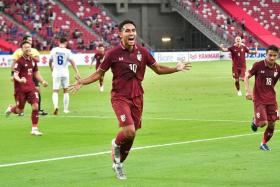 Thailand&#039;s Teerasil Dangda celebrates after scoring in the 2-1 win over the Philippines.
