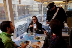 Customers have their Covid-19 health passes checked at a restaurant in Naples, Italy. The country&#039;s Health Ministry has moved Singapore to a list of countries deemed to be at higher risk of Covid-19 infections.