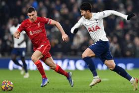 Liverpool&#039;s midfielder James Milner (left) and Tottenham Hotspur&#039;s South Korean striker Son Heung-Min chase the ball in the sides&#039; 2-2 draw on Dec 19, 2021.