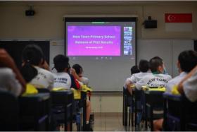 New Town Primary pupils waiting for their PSLE results on Nov 24, 2021. More than 90 per cent of this year's PSLE cohort was posted to a secondary school in their six listed choices.