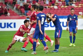 Singapore&#039;s Faris Ramli (second from right) reacts after missing a penalty in the semi-final defeat by Indonesia. 