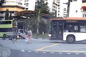 Close shave for pedestrians who avoid SBS Transit bus that beat red light