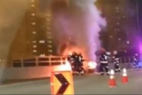 In a video circulating on social media, at least four firefighters were seen hosing down the Porsche.