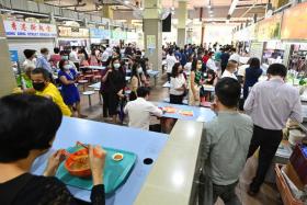 People buying food and having lunch at Amoy Street Food Centre on Jan 12, 2022.