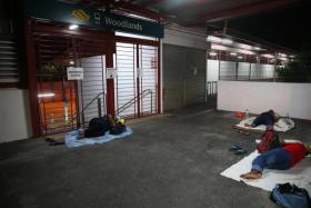Half of those sleeping near Woodlands MRT station were foreign workers resting before starting work there.