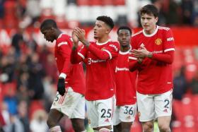 The Manchester United team applauding fans after the EPL match against Watford, on Feb 26, 2022. 
