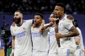 Real Madrid&#039;s Karim Benzema celebrates with Lucas Vazquez, Eder Militao, Vinicius Junior and Rodrygo after the match. 
