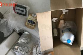 Bathroom cleaner spilled onto food items packed together in Redmart Delivery