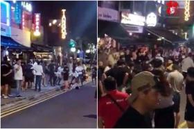 A video posted on Facebook group Complaint Singapore shows a group of men brawling on the pavement on April 8, 2022.