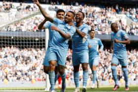 Manchester City&#039;s Gabriel Jesus celebrates with teammates after scoring their fourth goal.