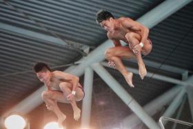 Max Lee (left) and Jonathan Chan competing at the Singapore National Diving Championships on April 10, 2022. 