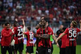 AC Milan players and Rafael Leao (centre) celebrate their 2-0 win over Atalanta, on May 15, 2022. 