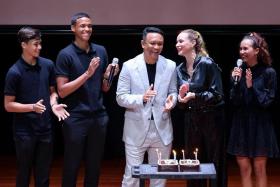 Fandi Ahmad (centre) celebrating his birthday with his wife Wendy Jacobs and children (from left) Iryan, Ilhan and Iman. 
