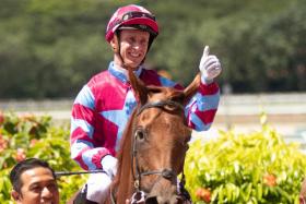 Visiting Australian jockey Daniel Moor giving the thumbs up after winning on the James Peters-trained Fast And Fearless at Kranji on Sunday.
