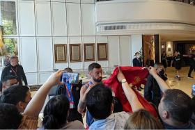 Manchester United&#039;s Bruno Fernandes signing autographs for fans at the Athenee Hotel in Bangkok. 