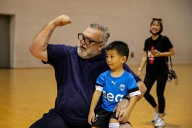 Neil Ruddock, 54, a former Liverpool defender during the 1990s, at a football clinic organised by the Singapore Sports Hub at OCBC Arena on Thursday (July 14). 