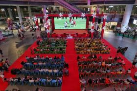 Football fans watching a live screening of an English Premier League match between Fulham and Liverpool at Our Tampines Hub on Aug 6, 2022. 