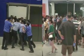 Screengrabs from a video posted on Weibo showed customers forcing their way through as security officers tried to close the doors to prevent people from leaving after an IKEA store in Shanghai announced it was locking down due to suspected COVID-19 exposure.

