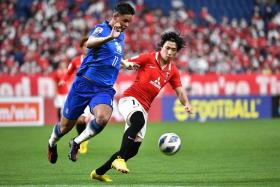 Pathum's Irfan Fandi (left) in action against Urawa's Yusuke Matsuo during their AFC Champions League match in Saitama on Aug 22, 2022. 