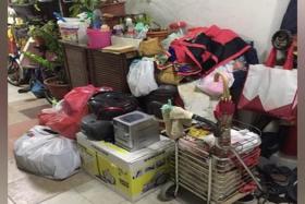 A photo taken in 2019 of the area outside Mr Kumar&#039;s flat, where various items had piled up. PHOTO: MR KUMAR